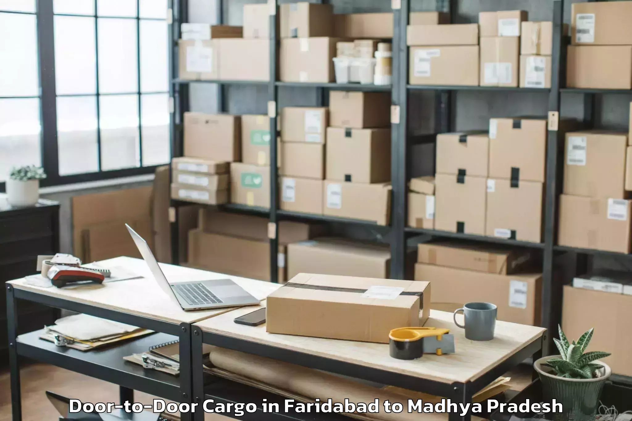 Book Faridabad to Khachrod Door To Door Cargo Online